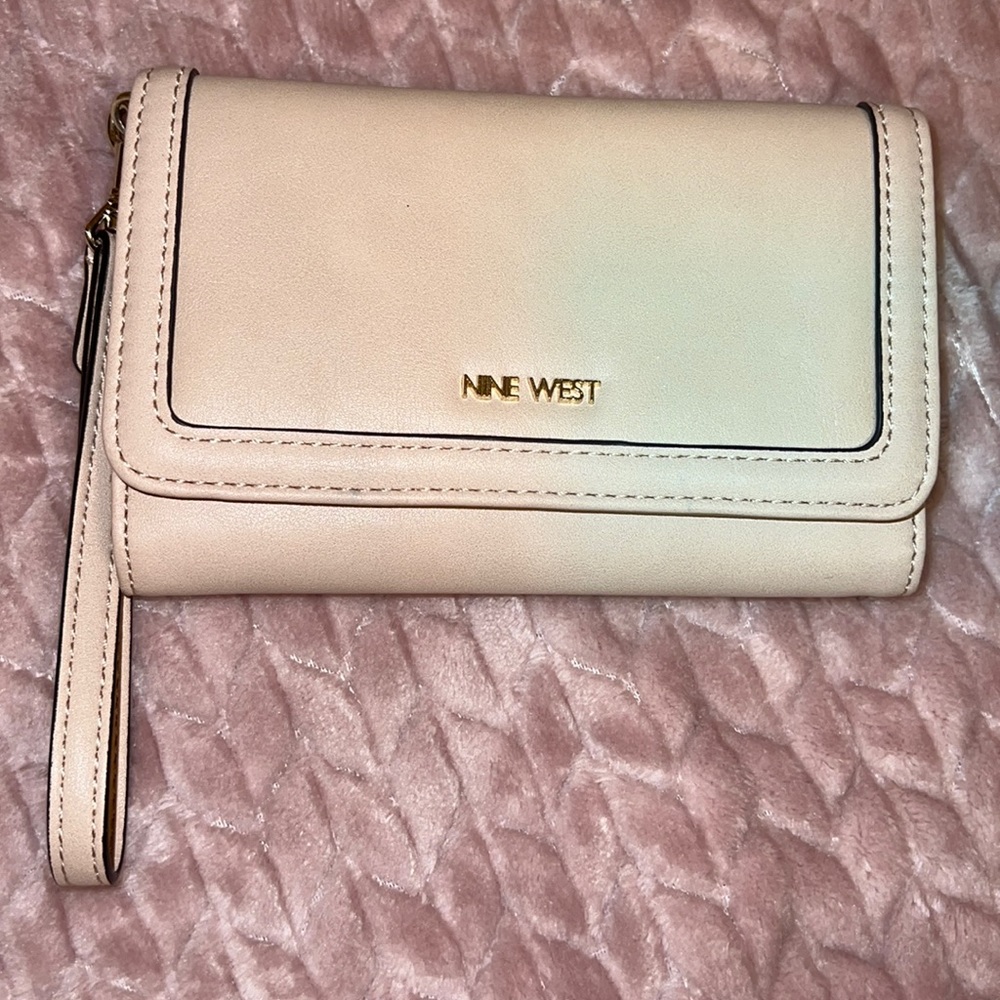 Beige wristlet wallet w/ 3 Credit Card slots and DL. Compartment for phone.